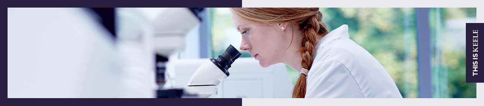 Female looking through microscope