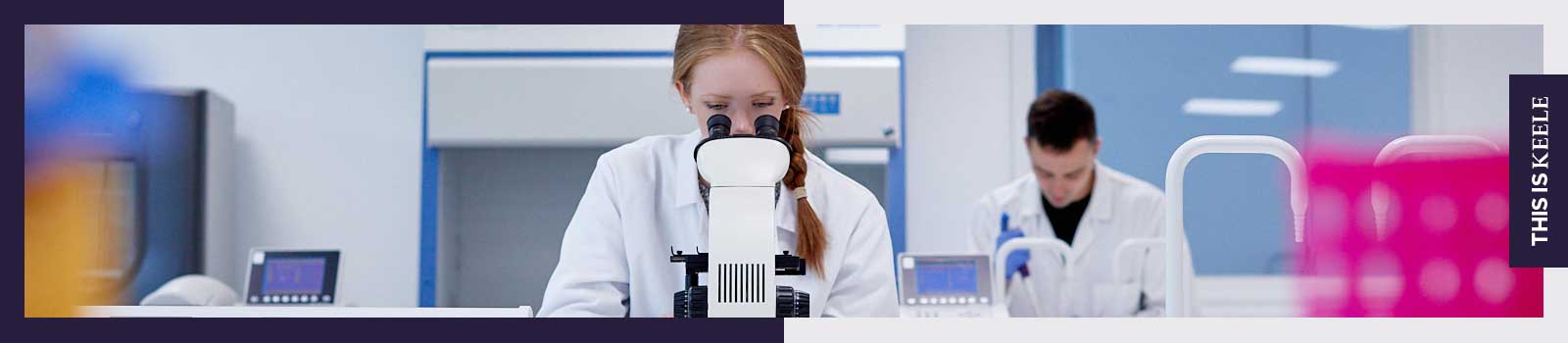 Student in laboratory looking into microscope